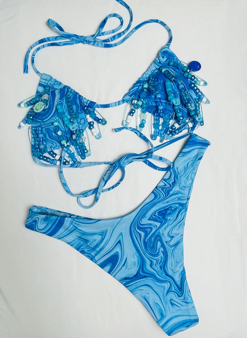 Blue marbled bikini set on a white background
